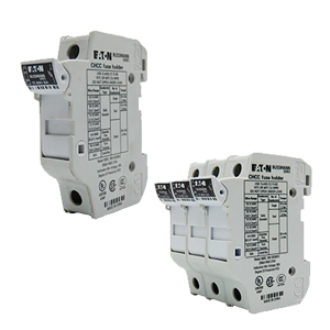 Two white electrical circuit breakers with detailed labels and specifications.
