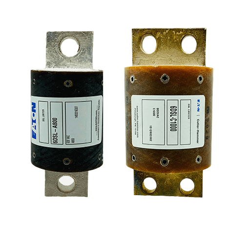 Two electrical fuses with labels displayed.